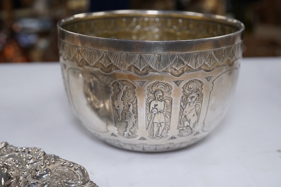 Two Victorian silver sugar bowls, a Victorian silver gilt sifter ladle and a repousse silver dish, 11.8oz. Condition - fair to good